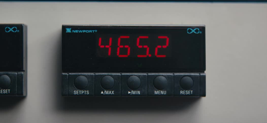Digital numbers change on a process panel meter