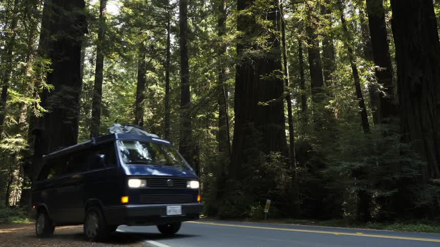 A van pulls out onto a secluded road