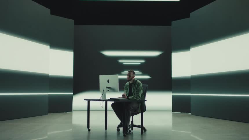 A man working on designing on a computer