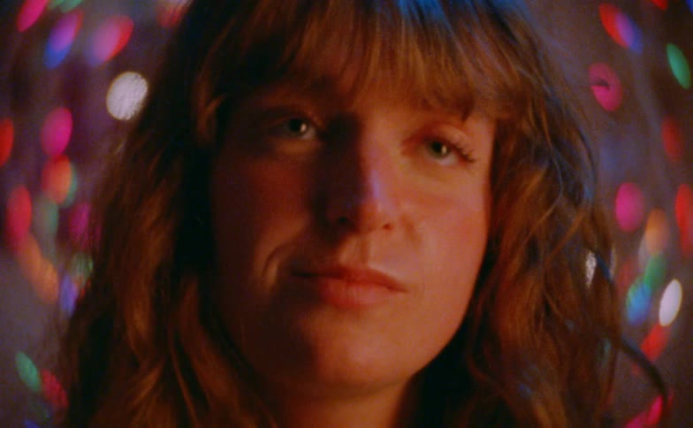A woman smiling softly