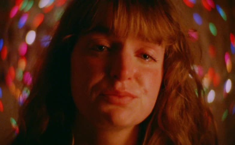 Persons face in closeup with warm lighting and