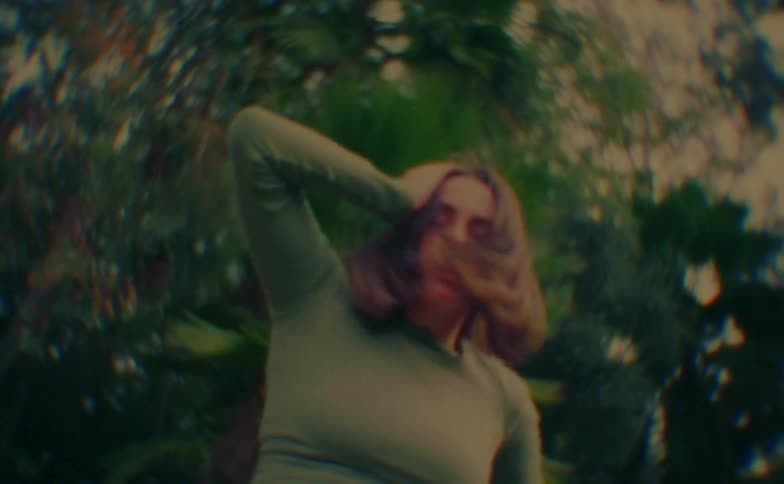 A woman dancing outdoors