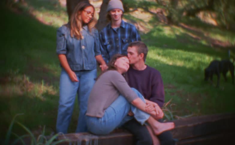The two couples smile and talk