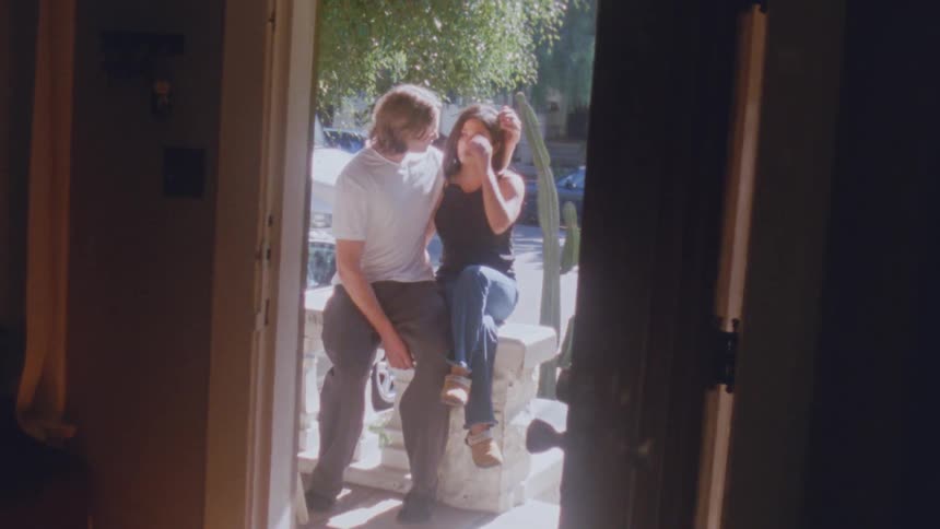 A man and woman kissing each other