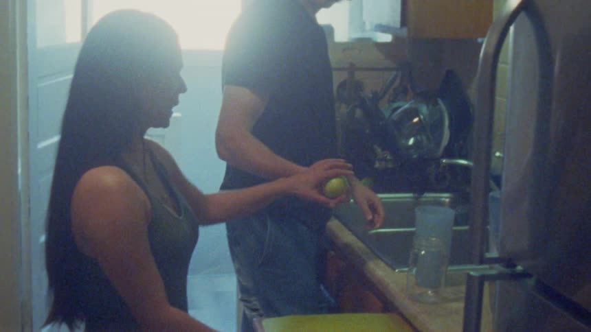 Woman cutting a lemon