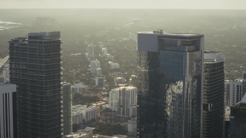 Drone of downtown Miami as camera tilts down skyscapers