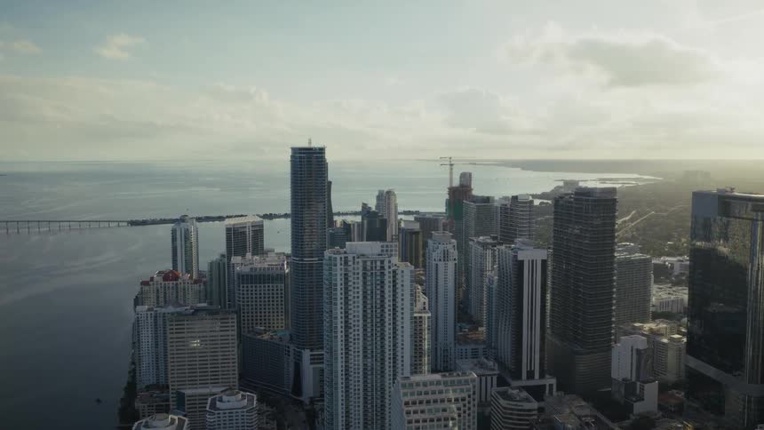 Towers and skyscrapers among buildings of a metropolitan city on the coast