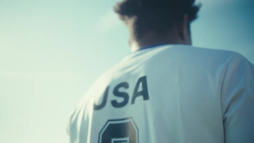 Person in usa athletic jersey under clear sky
