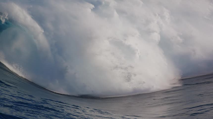 Person surfing a strong wave and falling