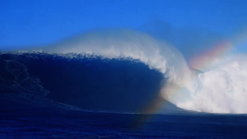 Large powerful wave breaking generating foam in the ocean