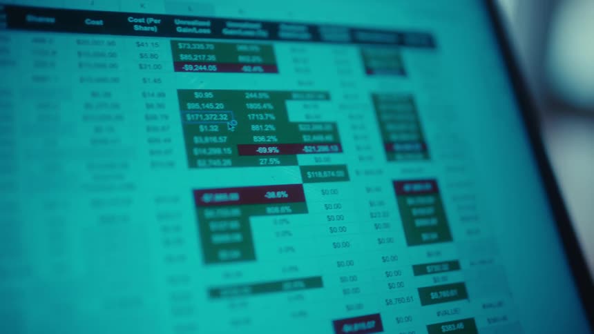 Laptop screen displaying a spreadsheet with numbers