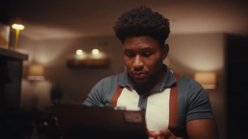A man using a laptop in a room