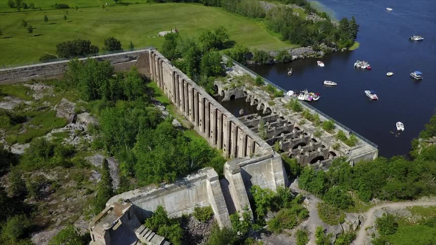 Aerial view of a large stone structure next to water