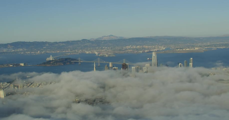 Aerial view of fog, Bay Bridge, downtown San Francisco, California