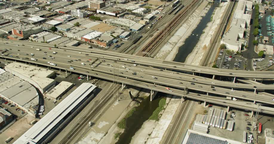 Cars drive on a freeway system in Los Angeles, California