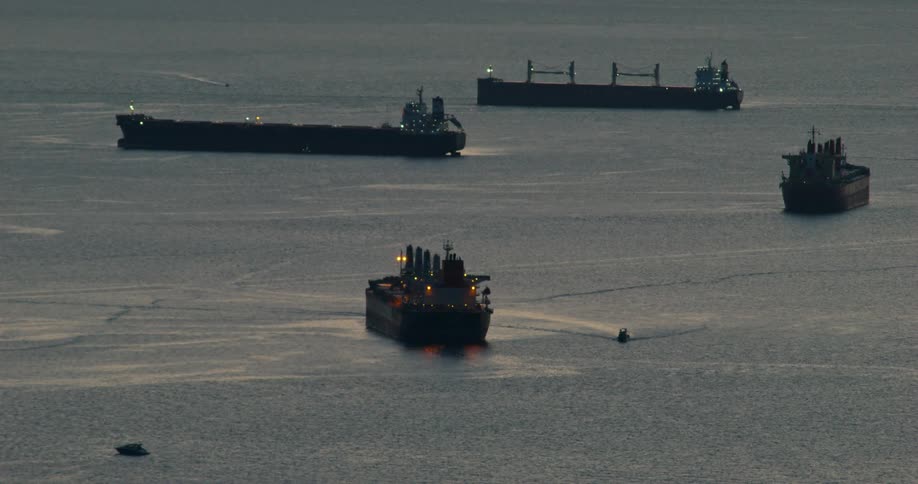 Ships on the ocean outdoors during dusk or dawn