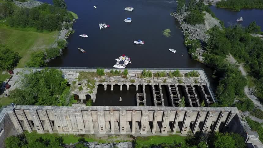 Boats float near a dam below