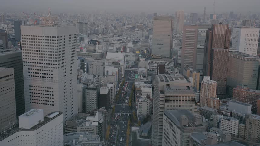 Neighborhood on a metropolitan area with dense traffic outdoors during dusk or dawn