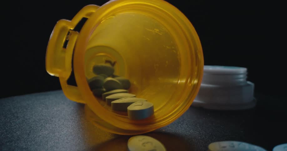 Pills scattered out of a fallen container