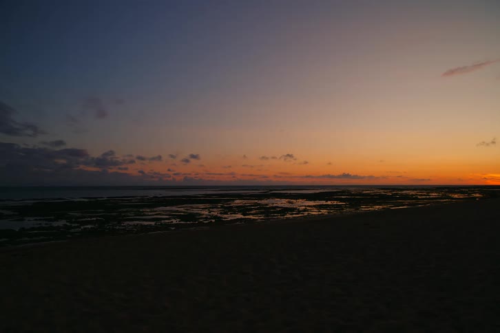 Beach landscape with an orange sky