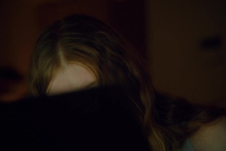 Close- up of t he woman is looking at a monitor