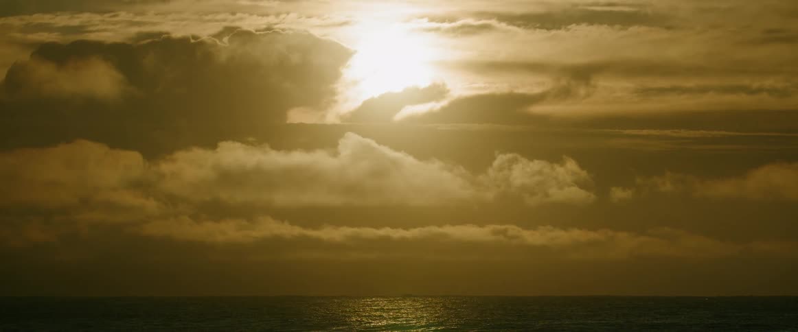 The sun is rising above the clouds