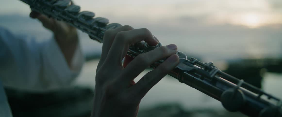 A person playing a flute