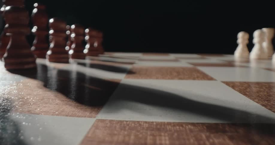 Chess piece over a chessboard indoors