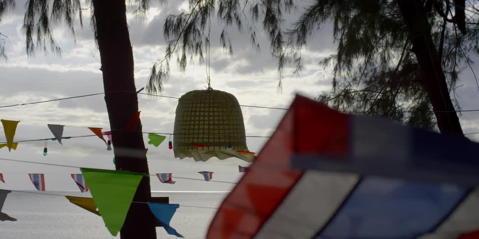 Flags on rope lines swaying in the ocean breeze