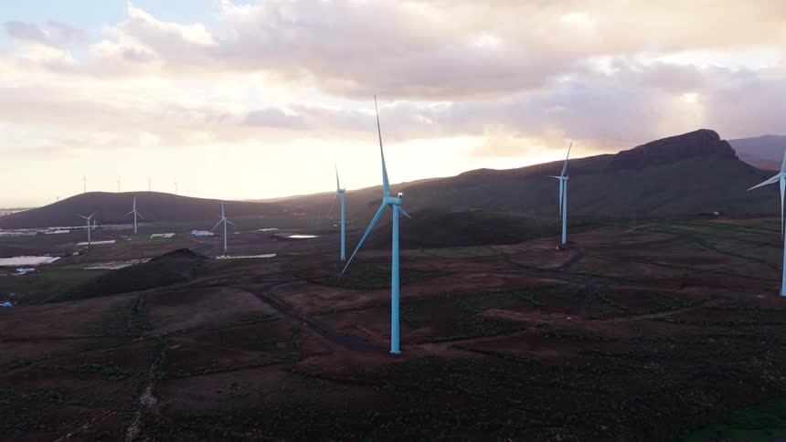 Solar panels and wind turbines in the rural mountains