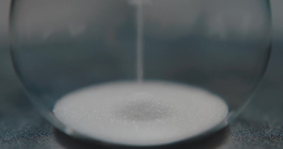 An hourglass filling with sand