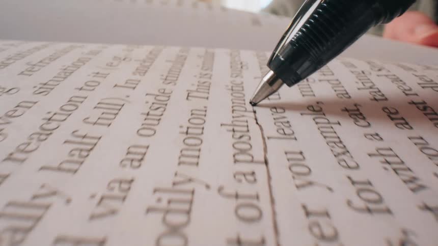 The handdrawn line as the video progresses a person draws a dark slightly shaky vertical line in the middle of the page it begins near the word conditioning and moves downward toward the bottom of the frame passing through phrases like posthypnoti