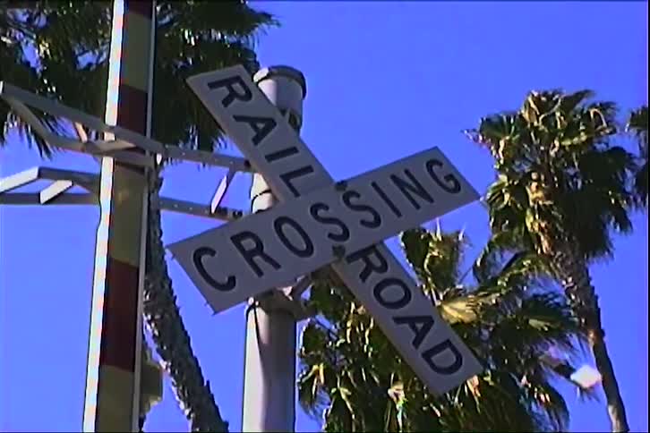 Sign with tropical palm trees in the background