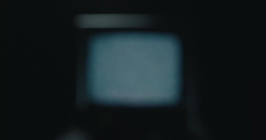 Television with a blurry screen in a dark environment