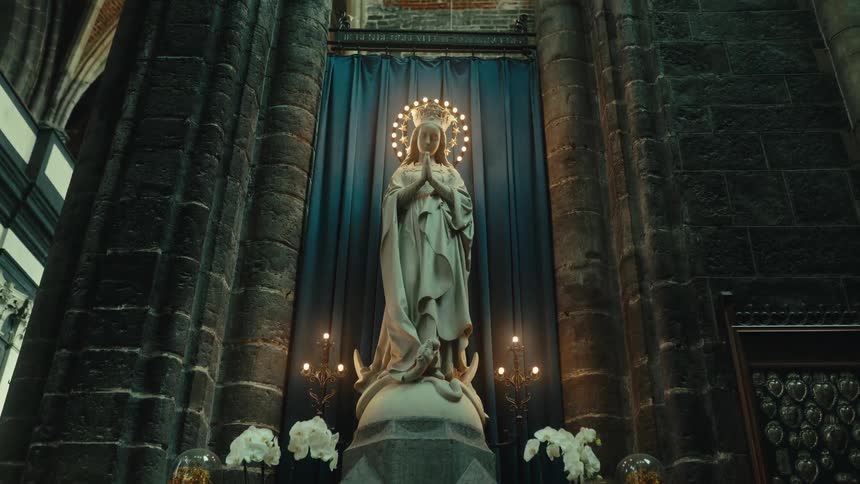 Statue of the ave maria inside a cathedral