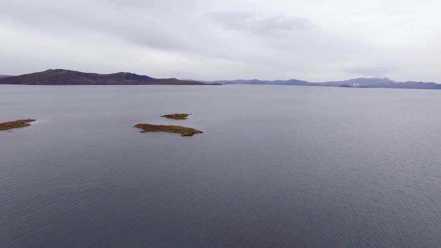 Three small islands sit in the middle of this lake