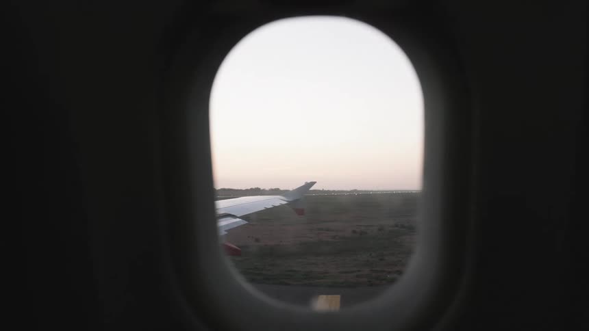 Interior view from the window of a moving airplane