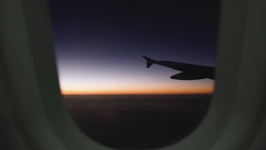 Two planes fly side by side