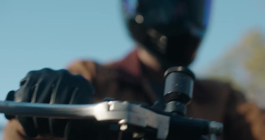 Man in helmet riding motorcycle