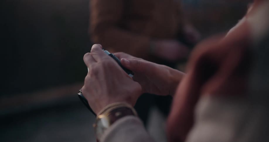 A person checking film in a camera