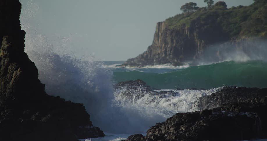 Strong wave crashing against rocks