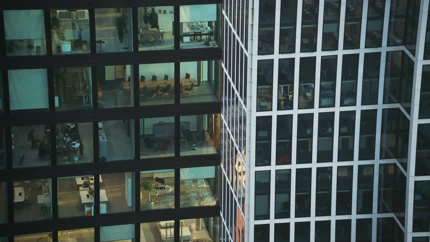 The office buildings are tall with many floors