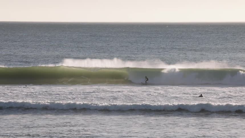 A person surfing on a large wave