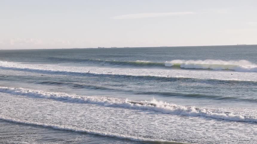 Waves on a moving beach