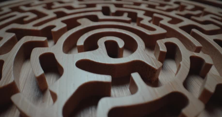 A close up of a wooden carved maze