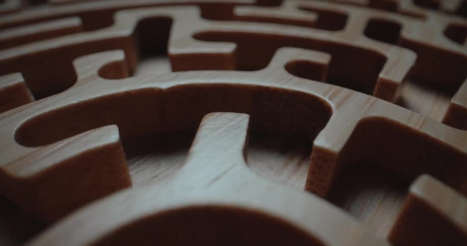 A wooden carved maze