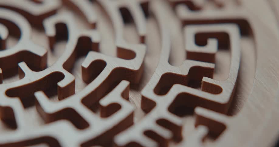 Light brightens area briefly allowing a glimpse of a maze on a circular surface