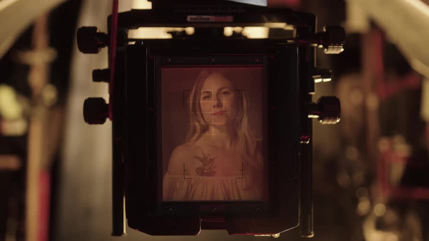 Portrait displayed on a professional camera viewfinder in a studio