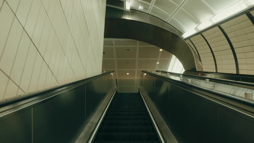 An escalator moving up out of a terminal