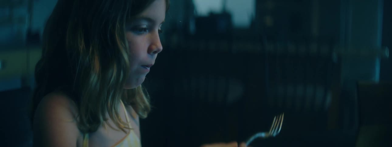 Little girl eating a slice of cake
